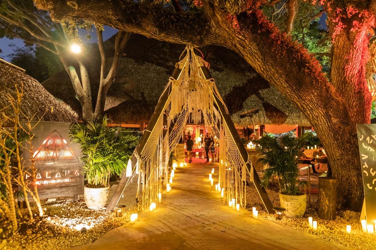 Palapa at Upper Buena Vista at night — candlelit tiki entrance, the venue for The Jazz Room